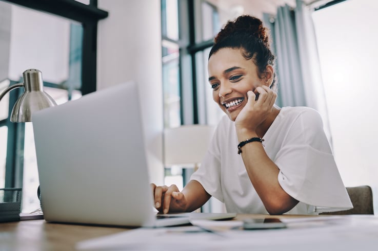 woman looking at laptop