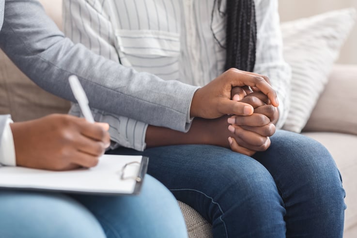 mental health professional comforting patient